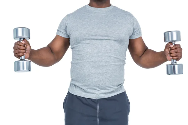 Fit man exercising with dumbbells — Stock Photo, Image