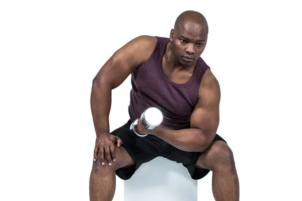 Fit man exercising with dumbbell — Stock Photo, Image