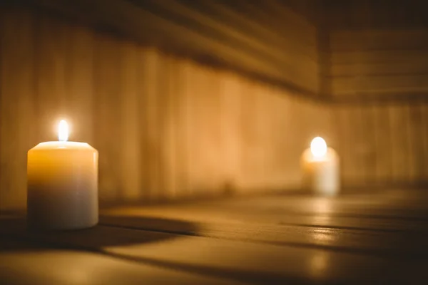 Sauna room with lit candles — Stock Photo, Image