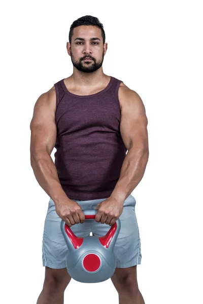 Man holding a kettlebell — Stock Photo, Image