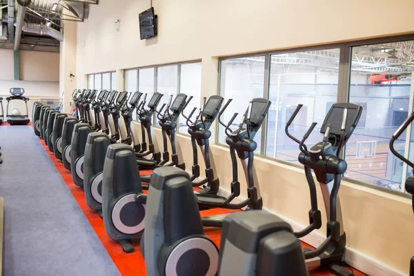 Collection of exercise bikes in a row — Stock Photo, Image