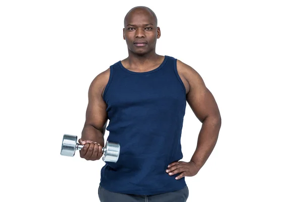 Gespierde man uitoefenen met dumbbell — Stockfoto