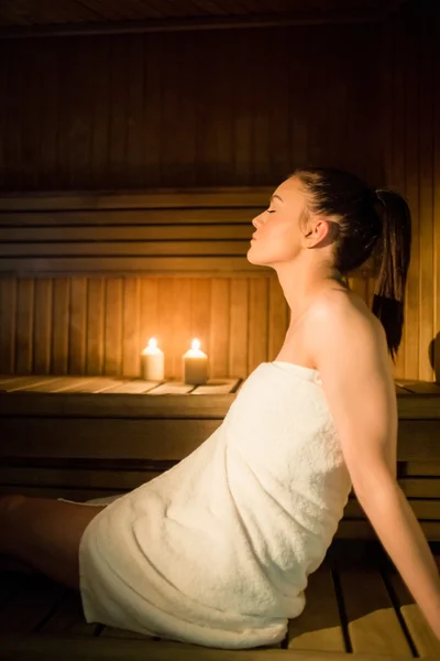 Pretty woman relaxing in the sauna — Stock Photo, Image