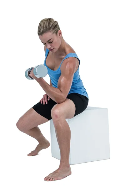 Woman exercising with dumbbell — Stock Photo, Image