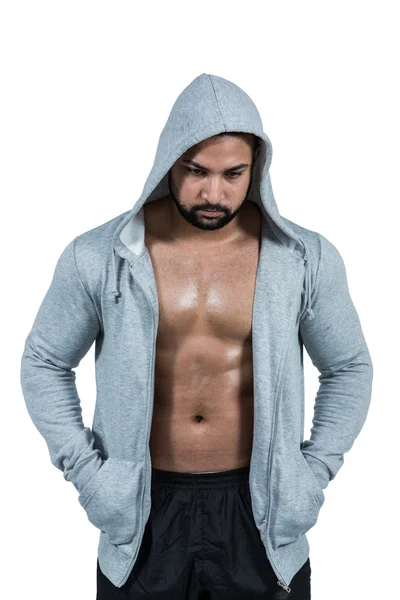 Uomo muscoloso in maglione con cappuccio — Foto Stock