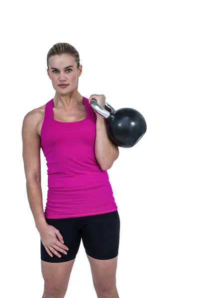 Mujer haciendo ejercicio con kettlebell — Foto de Stock