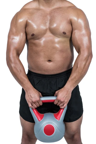 Man lyfta tunga kettlebell — Stockfoto