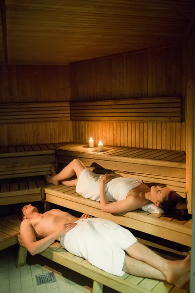 Couple relaxing in the sauna — Stock Photo, Image