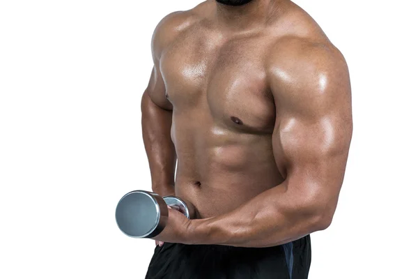 Muskulöser Mann, der eine schwere Hantel hebt — Stockfoto