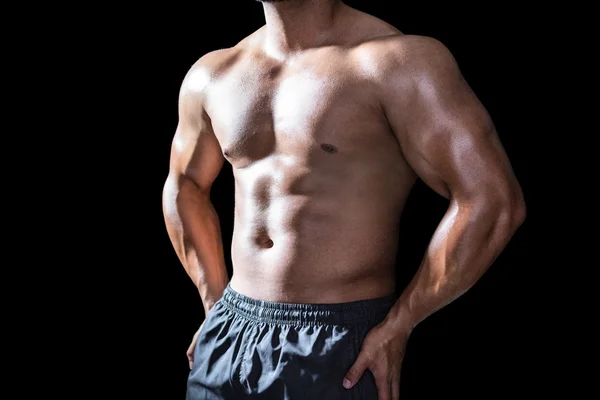 Mitten delen av en bodybuilder man — Stockfoto