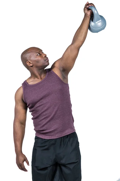 Hombre en forma haciendo ejercicio con kettlebell —  Fotos de Stock