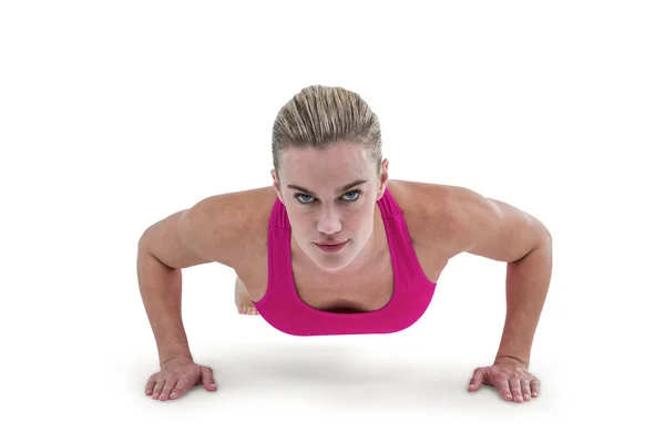 Portrait of pretty woman doing push ups — Stock Photo, Image