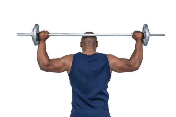 Man lifting heavy barbell — Stock Photo, Image