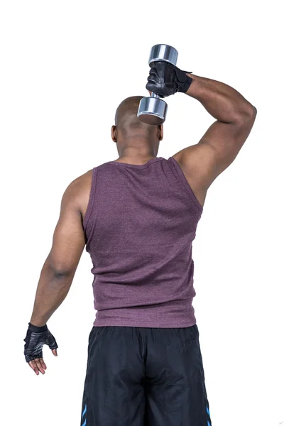 Hombre haciendo ejercicio con mancuerna — Foto de Stock