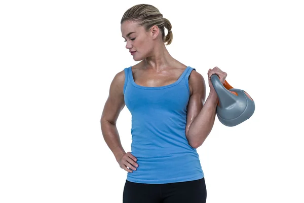 Woman exercising with kettlebell — Stock Photo, Image