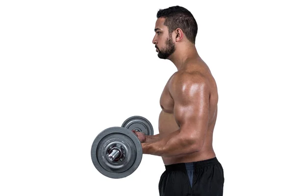Muscular man lifting heavy barbell — Stock Photo, Image