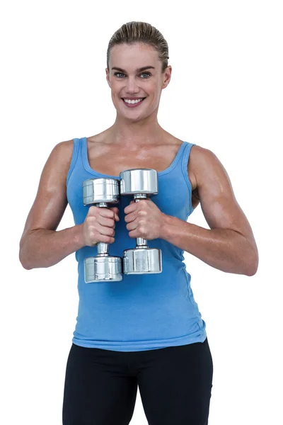 Woman exercising with dumbbells — Stock Photo, Image