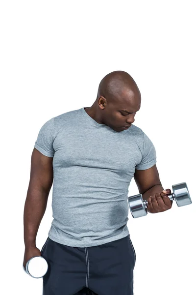 Hombre haciendo ejercicio con mancuerna — Foto de Stock