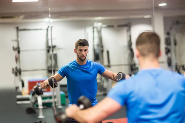 Man using weights in his workout — Stock Photo, Image