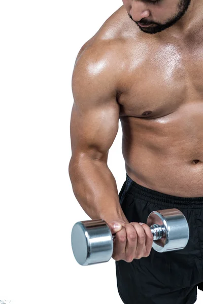 Muscular man lifting heavy dumbbell — Stock Photo, Image