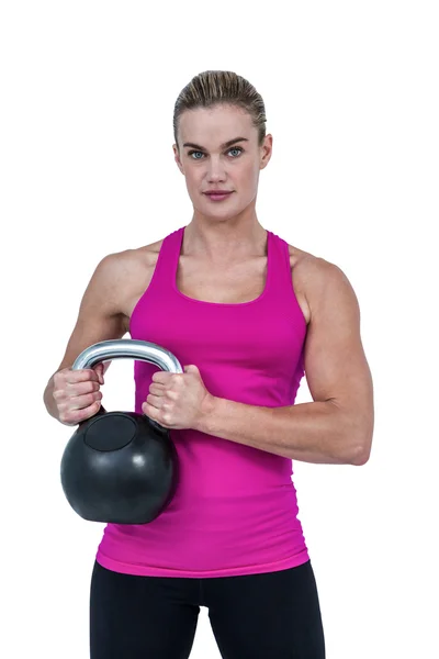 Mujer haciendo ejercicio con kettlebell — Foto de Stock