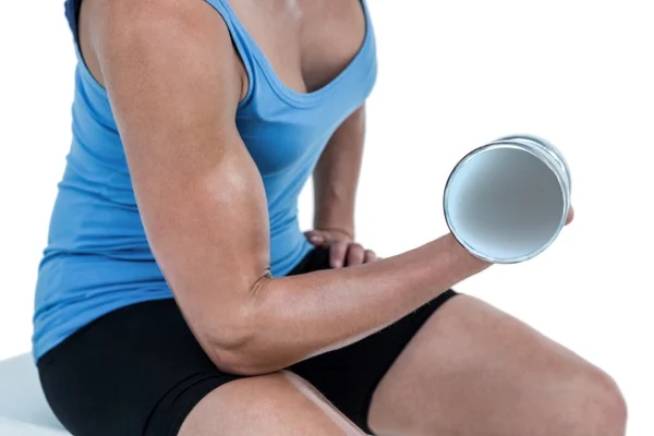 Woman exercising with dumbbell — Stock Photo, Image