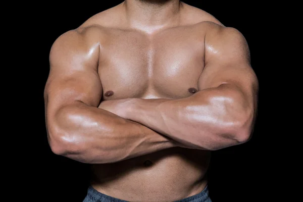 Bodybuilder Mann mit verschränkten Armen — Stockfoto