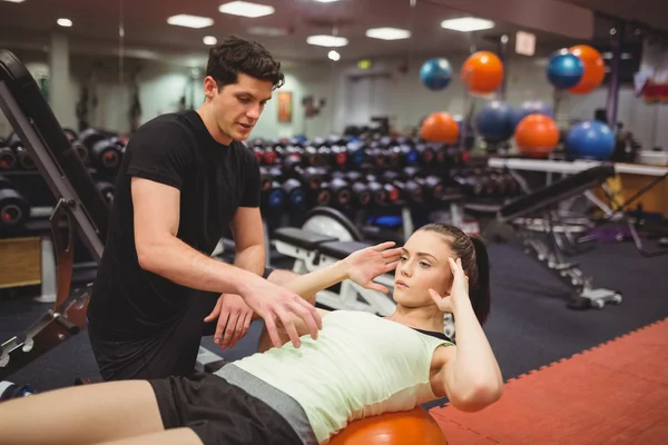 Fit woman working out with trainer — Stock Photo, Image