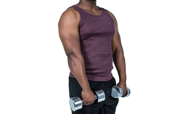 Hombre en forma haciendo ejercicio con pesas —  Fotos de Stock