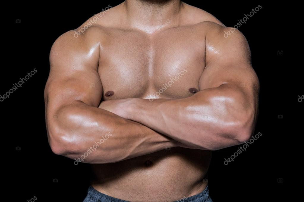 Bodybuilder man with arms crossed Stock Photo by ©Wavebreakmedia 90458230