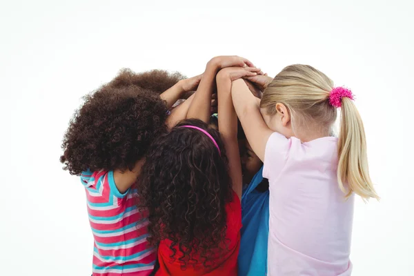 Small group of girls huddled together — Stock Photo, Image