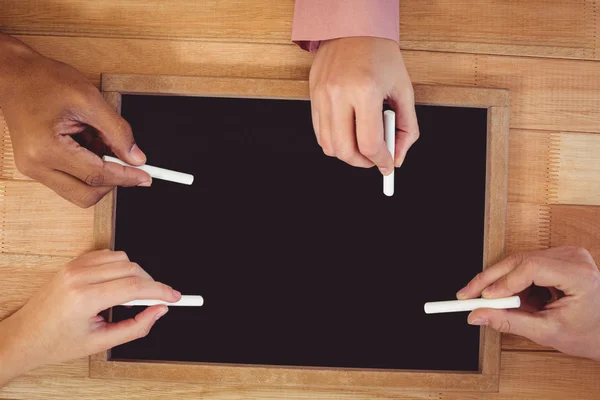 Creative team using chalkboard — Stock Photo, Image