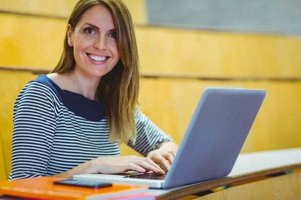 Mature student in lecture hall — Stock Photo, Image