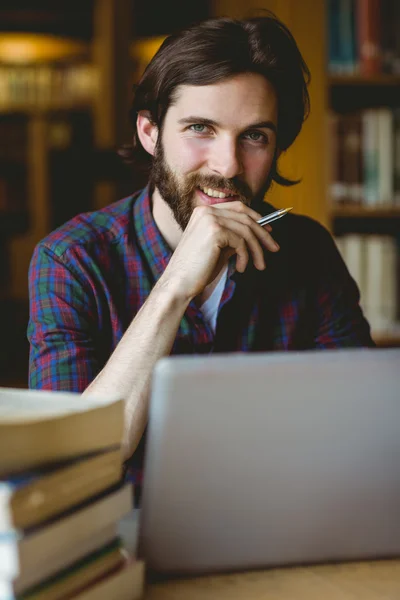 Hipster student studying in library — Stock Photo, Image