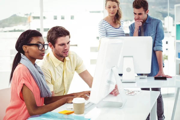 Creative business team working hard together on pc — Stock Photo, Image