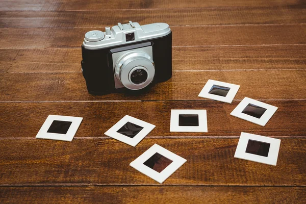 Old camera with photos slides — Stock Photo, Image