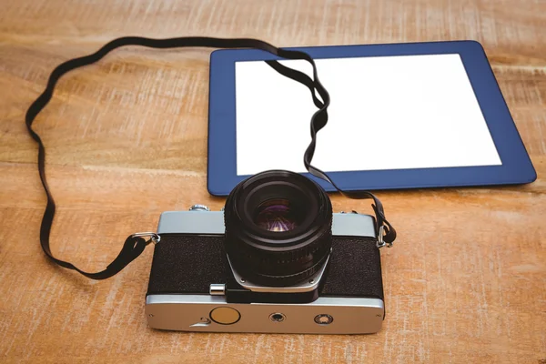 Old camera and blue tablet — Stock Photo, Image