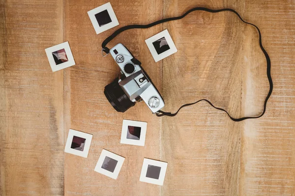 Old camera with photo slides — Stock Photo, Image