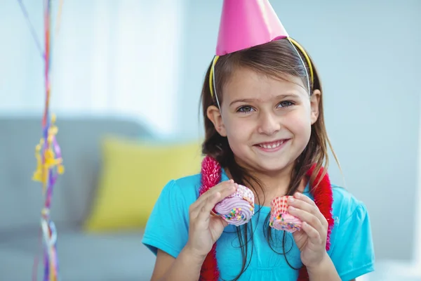 Smiling kid holding small buns — Stock Photo, Image