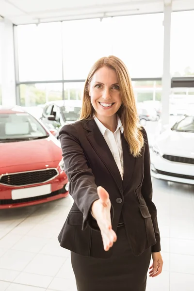 Smiling businesswoman reaching her hand — Stock Photo, Image