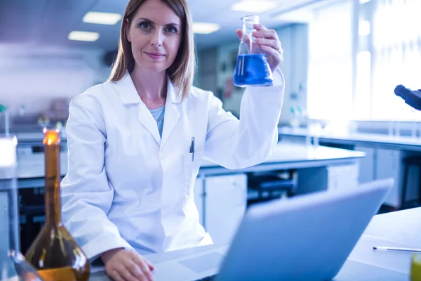 Scientist working with a laptop in laboratory — Stock Photo, Image