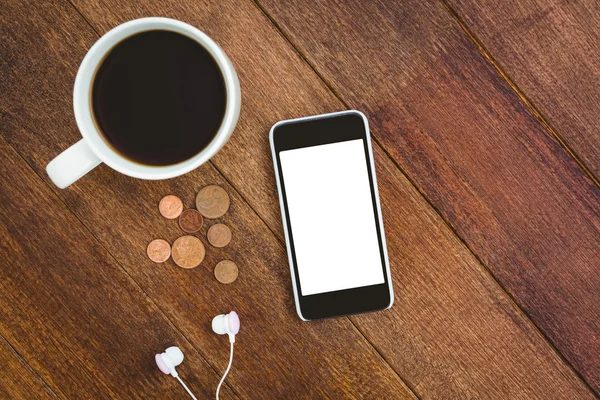 Vista de um smartphone branco com uma xícara de café — Fotografia de Stock