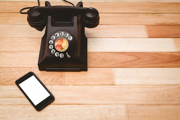 View of an old phone and a smartphone — Stock Photo, Image