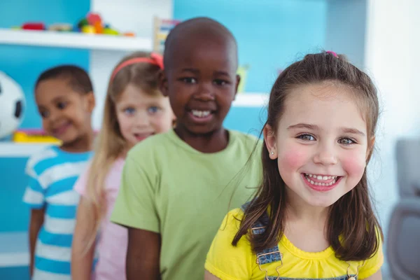 Happy kids standing in a line — Stock Photo, Image