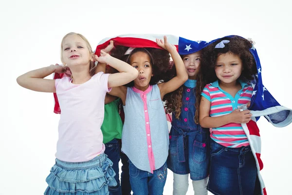 Girls standing with american flag overhead — Stock Photo, Image