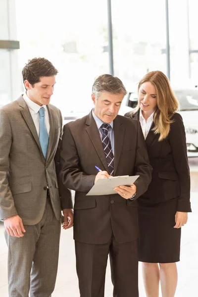 Smiling business team standing together — Stock Photo, Image