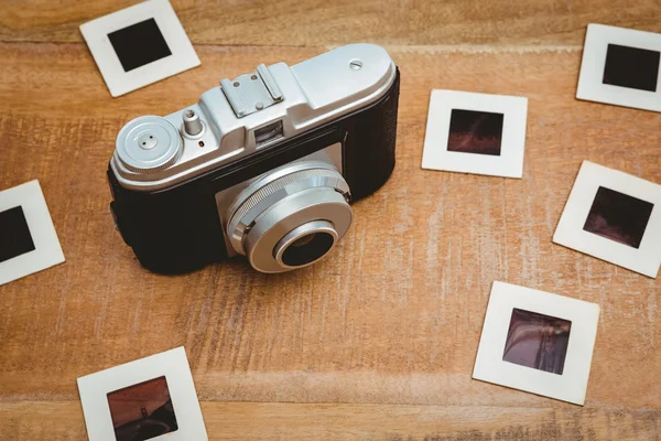 Old camera with photo slides — Stock Photo, Image