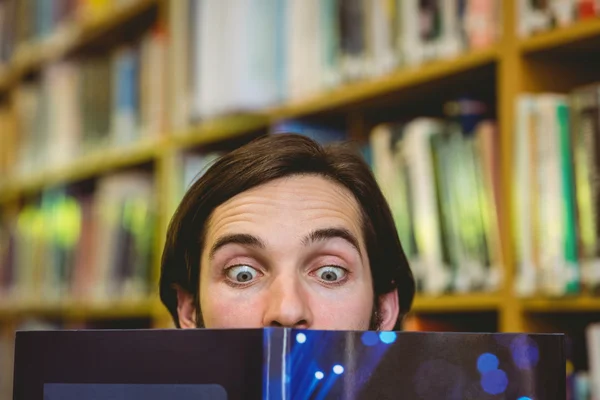 Student messing in the library — Stock Photo, Image