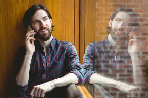 Hipster student on a call in canteen — Stock Photo, Image