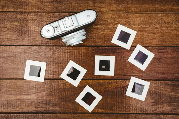 Old camera with photos slides — Stock Photo, Image